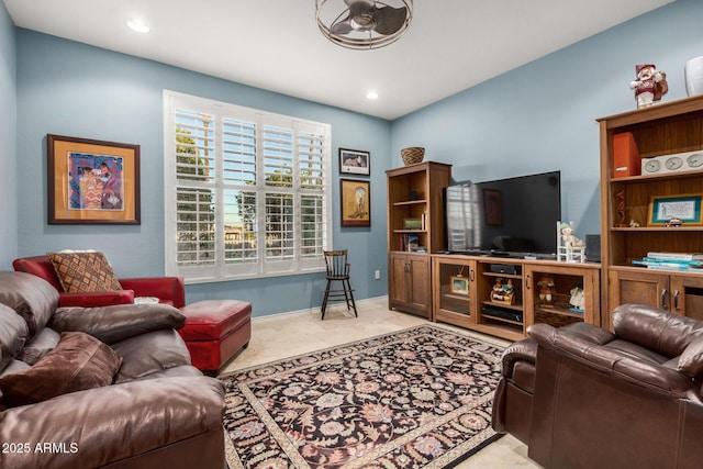 living area with baseboards and recessed lighting