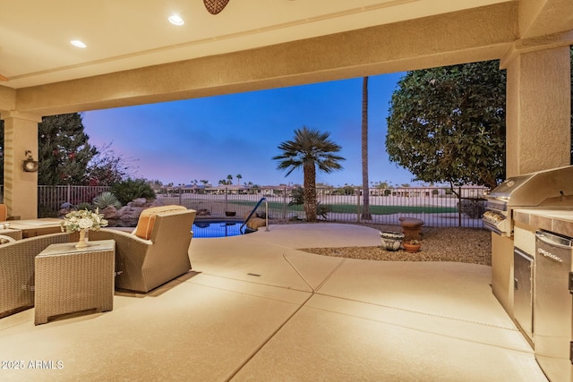 patio terrace at dusk featuring a fenced backyard, a grill, and a fenced in pool