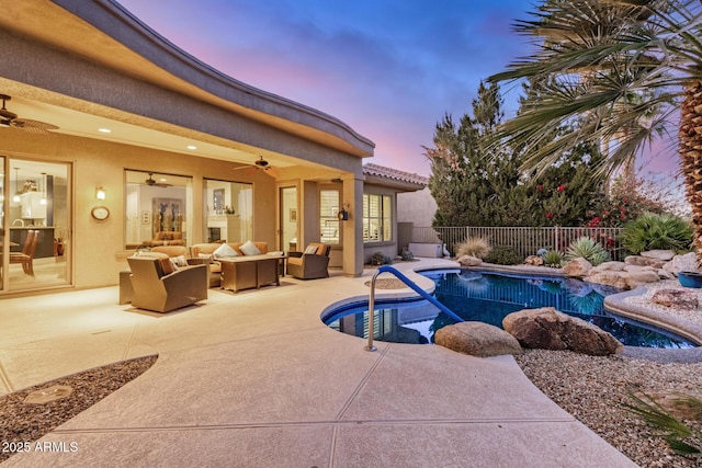 pool at dusk featuring a fenced in pool, a patio, ceiling fan, an outdoor hangout area, and fence