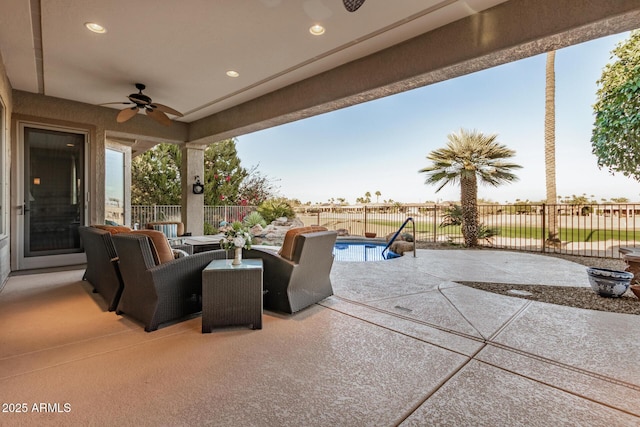 view of patio / terrace with ceiling fan, a fenced in pool, and a fenced backyard