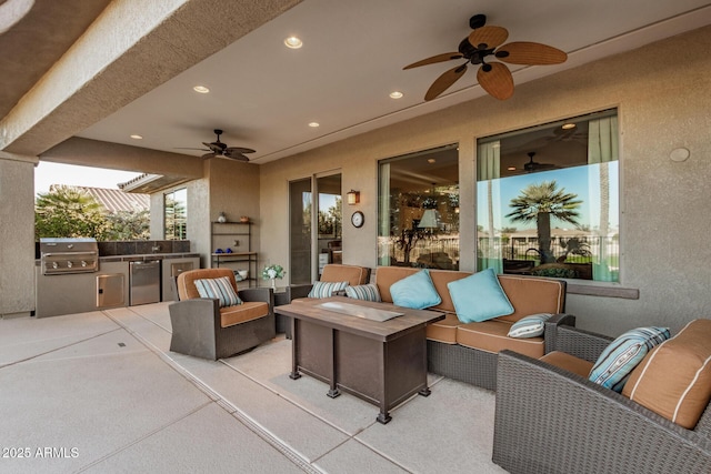 view of patio / terrace with exterior kitchen, an outdoor living space, ceiling fan, and grilling area