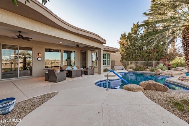 view of pool with ceiling fan, fence, an outdoor living space, and a patio