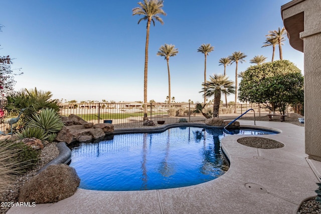 view of swimming pool with fence, a fenced in pool, and a patio