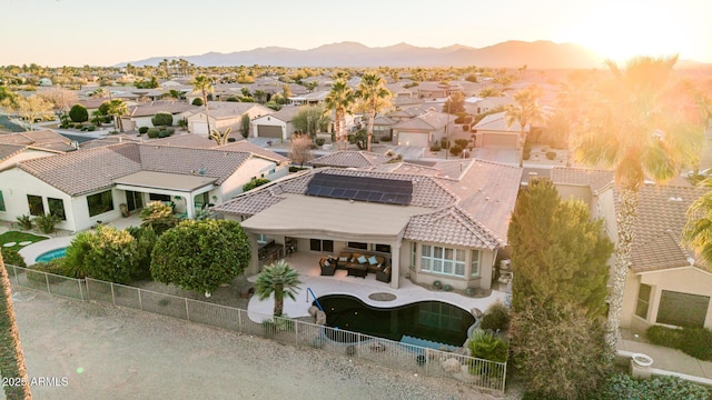 drone / aerial view featuring a residential view and a mountain view