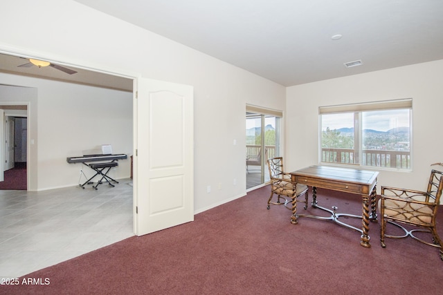 carpeted dining room with visible vents and baseboards