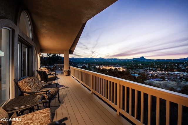 deck at dusk with a mountain view