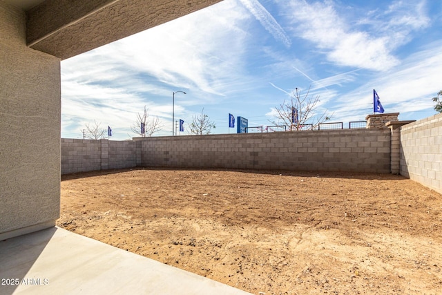 view of yard with a fenced backyard