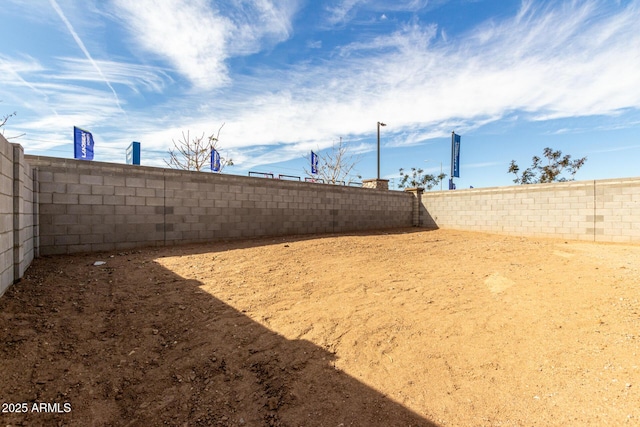 view of yard featuring a fenced backyard