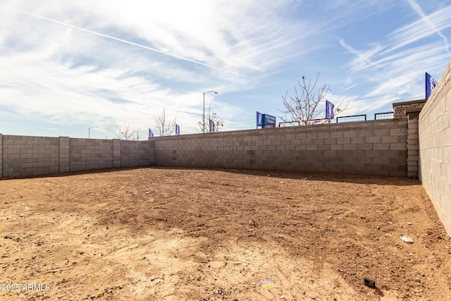 view of yard with a fenced backyard