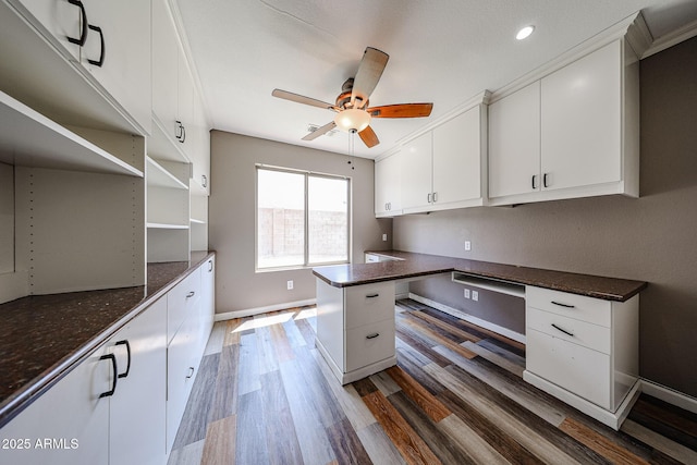 3033 E Millbrae Ln, Gilbert, AZ 85234 - kitchen with built in study area, ceiling fan, white cabinets, dark wood-style flooring, and recessed lighting