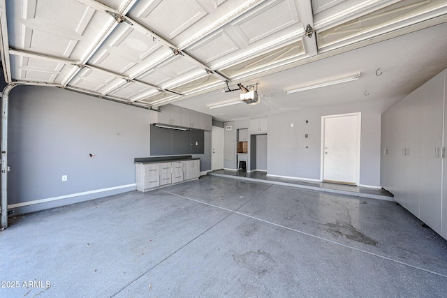 3033 E Millbrae Ln, Gilbert, AZ 85234 - garage featuring a garage door opener and baseboards