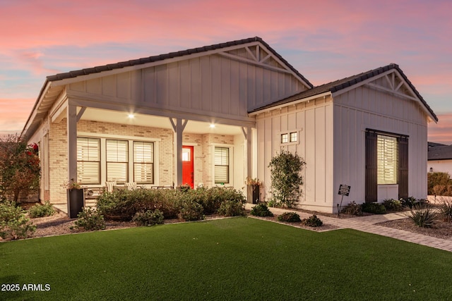 craftsman house featuring a yard and covered porch