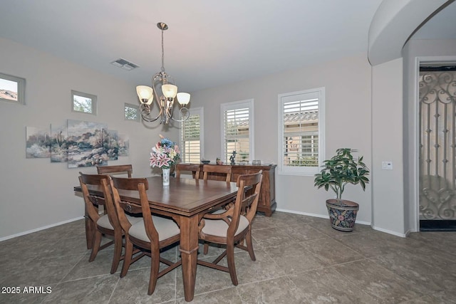 dining room with a chandelier