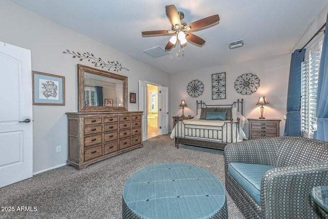 bedroom featuring ceiling fan, carpet flooring, and ensuite bath