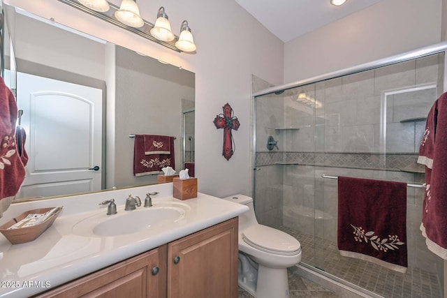 bathroom featuring walk in shower, tile patterned floors, vanity, and toilet