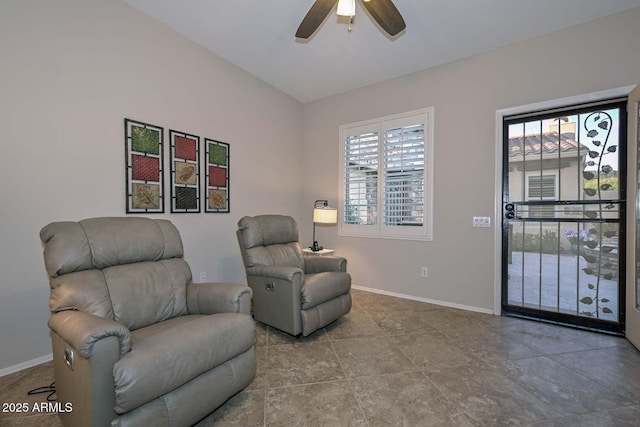 living area featuring ceiling fan