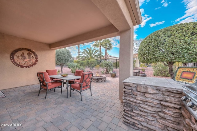 view of patio featuring an outdoor fire pit