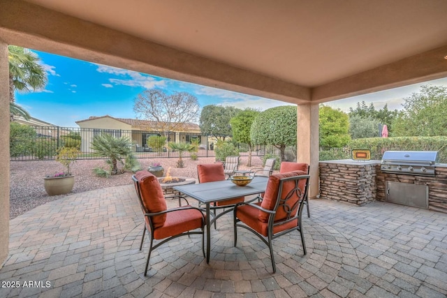 view of patio featuring a grill and exterior kitchen