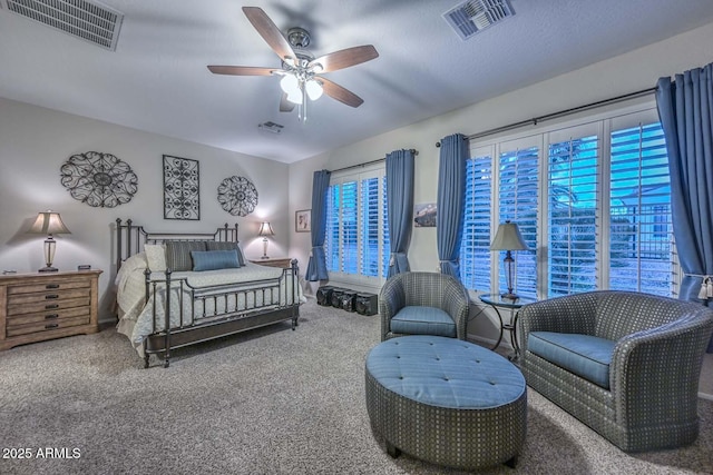 bedroom featuring multiple windows, carpet floors, and ceiling fan