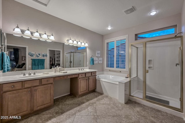 bathroom with shower with separate bathtub, vanity, and tile patterned floors