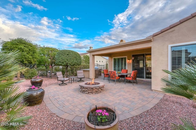 view of patio featuring a fire pit