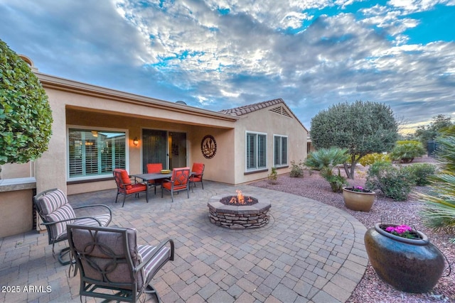 view of patio featuring a fire pit