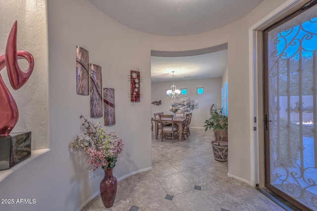 entrance foyer featuring a chandelier