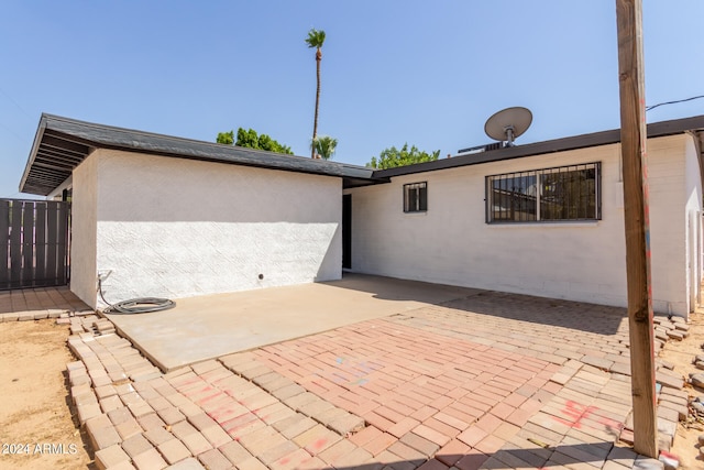 rear view of property featuring a patio area