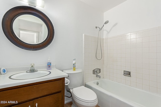 full bathroom with vanity, tiled shower / bath, and toilet