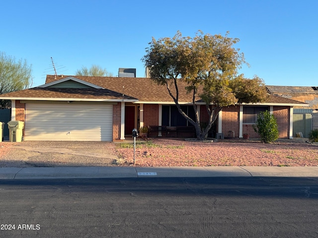 ranch-style home with a garage