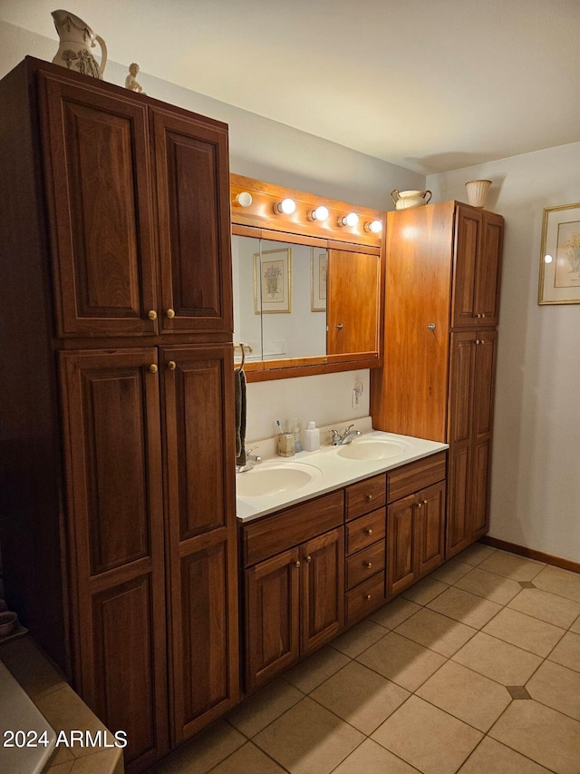 bathroom featuring tile patterned flooring and vanity