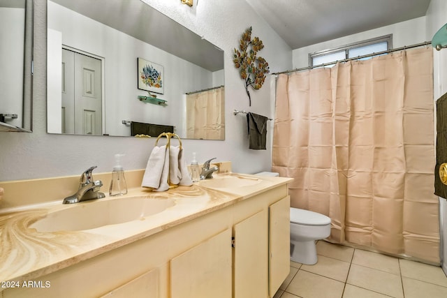 bathroom featuring vanity, toilet, walk in shower, and tile patterned floors