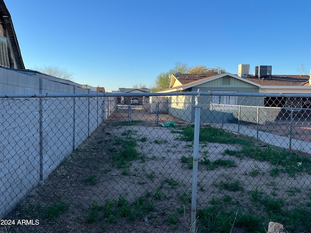 view of yard with central AC