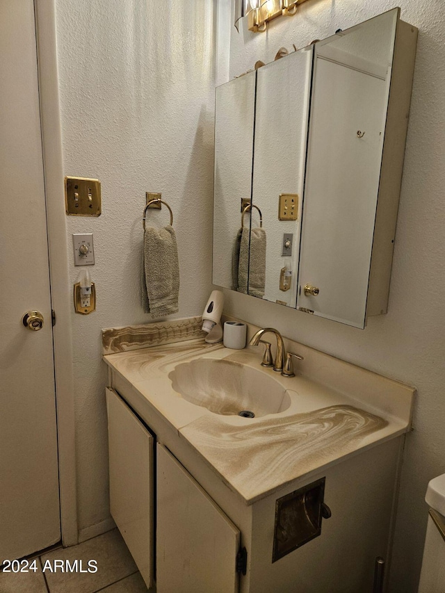 bathroom with vanity and tile patterned floors