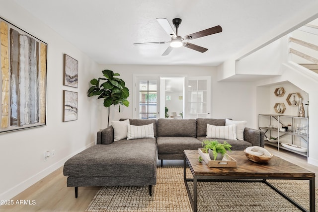 6001 N 10th Way, Phoenix, AZ 85014 - living room with light wood-style flooring, ceiling fan, and baseboards