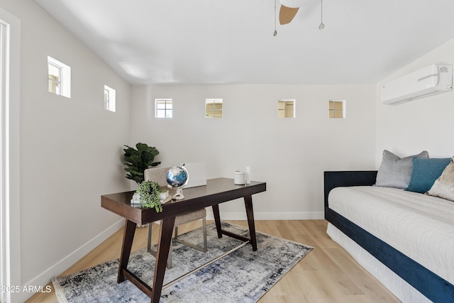 6001 N 10th Way, Phoenix, AZ 85014 - office space featuring a wall mounted air conditioner, light wood-type flooring, baseboards, and a ceiling fan
