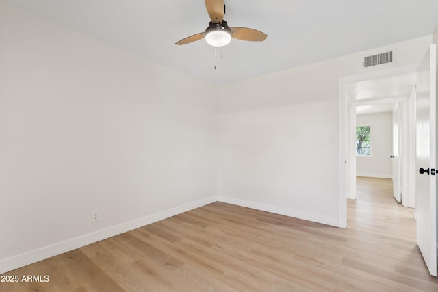 6001 N 10th Way, Phoenix, AZ 85014 - empty room featuring a ceiling fan, light wood-style flooring, and baseboards
