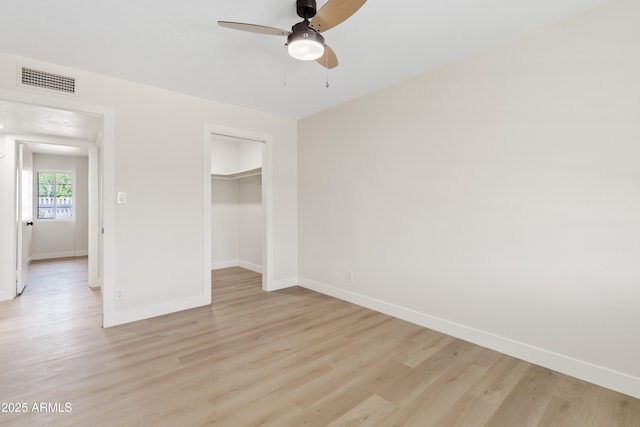6001 N 10th Way, Phoenix, AZ 85014 - unfurnished bedroom with baseboards, light wood-style flooring, and a closet
