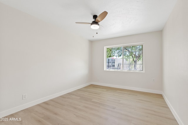 6001 N 10th Way, Phoenix, AZ 85014 - empty room featuring light wood-style flooring, ceiling fan, and baseboards