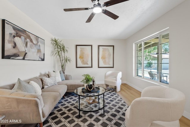 6001 N 10th Way, Phoenix, AZ 85014 - living area with a ceiling fan, wood finished floors, and baseboards