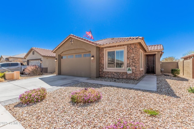 16573 W Alameda Rd, Surprise, AZ 85387 - mediterranean / spanish house featuring a tile roof, an attached garage, driveway, and stucco siding