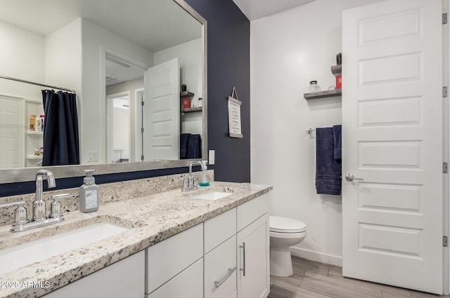 16573 W Alameda Rd, Surprise, AZ 85387 - full bath featuring double vanity, toilet, baseboards, and a sink
