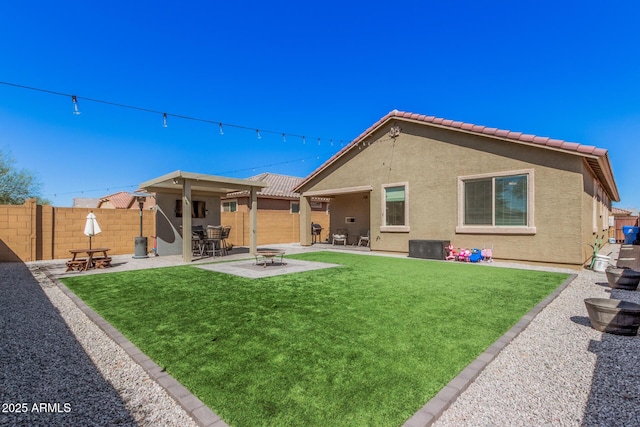 16573 W Alameda Rd, Surprise, AZ 85387 - back of property featuring a yard, stucco siding, a patio, and fence
