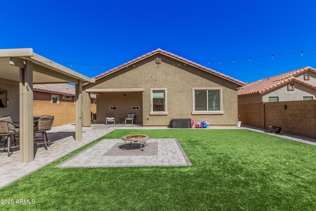 16573 W Alameda Rd, Surprise, AZ 85387 - rear view of house featuring fence, an outdoor fire pit, a lawn, and a patio area