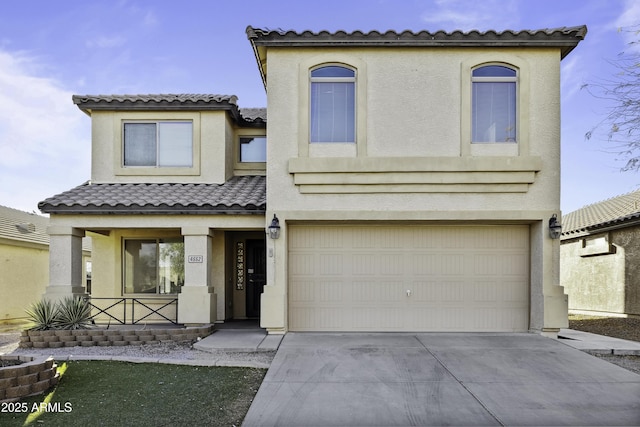 mediterranean / spanish-style house with covered porch, an attached garage, and stucco siding