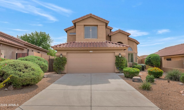 mediterranean / spanish-style home featuring a garage