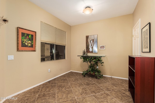 interior space with dark tile patterned flooring