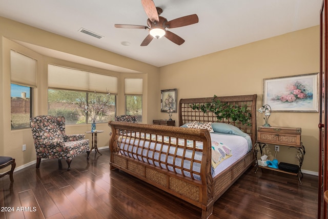 bedroom with ceiling fan and dark wood-type flooring