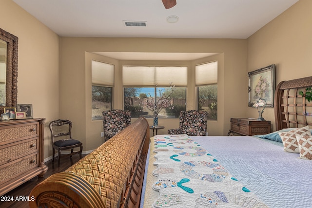 bedroom with ceiling fan and dark wood-type flooring