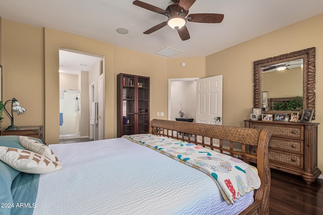 bedroom featuring ensuite bathroom, ceiling fan, and dark wood-type flooring